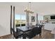 Bright dining area with modern light fixture connects to a spacious living room at 587 Mccaffrey Cir, Westfield, IN 46074