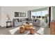 Inviting living room with large windows, gray sectional sofa, and stylish decor at 587 Mccaffrey Cir, Westfield, IN 46074