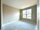 This bedroom features a large window and neutral paint, creating a serene and inviting space at 614 Silver Fox Ct, Indianapolis, IN 46217