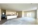 Spacious living room with a kitchen island, stainless steel faucet, and a sliding glass door at 614 Silver Fox Ct, Indianapolis, IN 46217