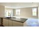 Spacious living room with a kitchen island, stainless steel faucet, and lots of natural light at 614 Silver Fox Ct, Indianapolis, IN 46217