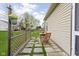 Charming backyard patio with a small table and chairs, perfect for enjoying the outdoors at 6537 Amherst Way, Zionsville, IN 46077
