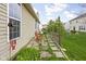 Inviting backyard with a stone paver patio, outdoor seating, and well-maintained landscaping at 6537 Amherst Way, Zionsville, IN 46077