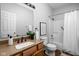 Bathroom featuring a vanity, sink, mirror, toilet, and shower with tub at 6537 Amherst Way, Zionsville, IN 46077
