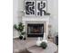 Close up of a fireplace with a white mantel and decor at 6537 Amherst Way, Zionsville, IN 46077