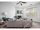 Cozy living room featuring a fireplace, plush sofa, and neutral tones at 6537 Amherst Way, Zionsville, IN 46077