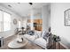 Open-concept living room with view to kitchen and dining area at 6537 Amherst Way, Zionsville, IN 46077