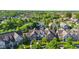 Breathtaking aerial view of a home in a community with mature trees and a pond at 6691 Beekman Pl, Zionsville, IN 46077