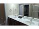 Bright bathroom featuring a double vanity, large mirror, and a glass-enclosed shower at 6691 Beekman Pl, Zionsville, IN 46077