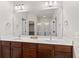 Stylish bathroom featuring a large mirror, dual sinks, and excellent lighting at 6691 Beekman Pl, Zionsville, IN 46077