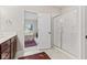 Bathroom with a clear view of the glass shower and bedroom, featuring a neutral design at 6691 Beekman Pl, Zionsville, IN 46077