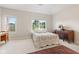 Bright bedroom with ample natural light from two windows, showcasing comfort at 6691 Beekman Pl, Zionsville, IN 46077