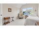 Bright bedroom featuring a large window, a comfortable chair, and natural light at 6691 Beekman Pl, Zionsville, IN 46077