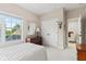 Bright bedroom with neutral decor, a large window, and closet space at 6691 Beekman Pl, Zionsville, IN 46077