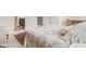 Spacious bedroom showcasing plush bedding, a view to the ensuite, and neutral decor at 6691 Beekman Pl, Zionsville, IN 46077