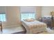 Bright bedroom with natural light, and cozy bedding at 6691 Beekman Pl, Zionsville, IN 46077