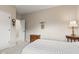 Cozy bedroom with neutral walls, dresser, carpet, and a comfortable bed at 6691 Beekman Pl, Zionsville, IN 46077