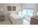 Inviting bedroom with a twin bed, artwork, and a window, creating a peaceful space for relaxation and rejuvenation at 6691 Beekman Pl, Zionsville, IN 46077