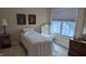 Bright bedroom featuring daybed, a comfortable chair, and a large window for natural light at 6691 Beekman Pl, Zionsville, IN 46077