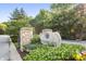 Stonegate entrance sign surrounded by lush landscaping and mature trees at 6691 Beekman Pl, Zionsville, IN 46077