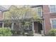Charming brick townhome with inviting front porch and mature landscaping at 6691 Beekman Pl, Zionsville, IN 46077