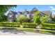 Charming exterior view of a multi-Gathering home, adorned with lush landscaping at 6691 Beekman Pl, Zionsville, IN 46077