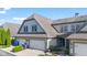 Charming townhome showcasing well-maintained siding, attached garages, and a neatly landscaped yard with mature trees at 6691 Beekman Pl, Zionsville, IN 46077