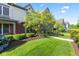 Well-maintained home with lush green lawn, mature trees, and landscaped garden at 6691 Beekman Pl, Zionsville, IN 46077