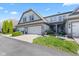 Well-maintained home with attached garages, manicured garden, and front entry at 6691 Beekman Pl, Zionsville, IN 46077
