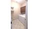Functional laundry room equipped with washer, dryer, and storage cabinets, providing convenience for laundry tasks at 6691 Beekman Pl, Zionsville, IN 46077