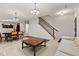 Open living and dining area with elegant lighting, and archway to another room at 6691 Beekman Pl, Zionsville, IN 46077