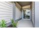 Cozy patio with sliding glass door to the house and small garden at 6691 Beekman Pl, Zionsville, IN 46077