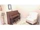 Charming music room featuring a piano, seating, and decor creating an inviting atmosphere for musical pursuits at 6691 Beekman Pl, Zionsville, IN 46077
