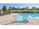 Outdoor swimming pool with blue water and a spacious deck area with lounge chairs at 6691 Beekman Pl, Zionsville, IN 46077