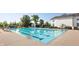 Large swimming pool with clear blue water and a well-kept deck area with lounge chairs at 6691 Beekman Pl, Zionsville, IN 46077