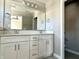 Bathroom featuring a double sink vanity with white cabinets and large mirror at 6882 Equality Blvd, Carmel, IN 46033