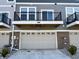 Townhome exterior featuring a balcony over a garage at 6882 Equality Blvd, Carmel, IN 46033