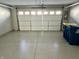 Garage with epoxy flooring and a white garage door at 6882 Equality Blvd, Carmel, IN 46033