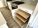 Custom kitchen cabinet pull-outs featuring multi-tiered shelving and adjustable compartments at 6882 Equality Blvd, Carmel, IN 46033