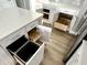 The kitchen has an island featuring pull-out drawers and a trash can cabinet for streamlined waste disposal at 6882 Equality Blvd, Carmel, IN 46033