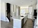 The kitchen has an island, stainless steel appliances, and lots of countertop space at 6882 Equality Blvd, Carmel, IN 46033