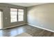 The living room features large windows that provide plenty of natural light and a glass door to the balcony at 6882 Equality Blvd, Carmel, IN 46033