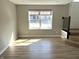 Bright living area featuring durable floors and large windows at 6882 Equality Blvd, Carmel, IN 46033