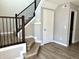 Elegant staircase with a durable landing and view of the lower level at 6882 Equality Blvd, Carmel, IN 46033