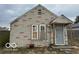 Charming exterior showcasing the home's stone facade and covered entryway at 714 S Biltmore Ave, Indianapolis, IN 46241