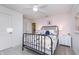 Bedroom featuring a decorative bed frame, and an adjacent ensuite bathroom at 7156 Firestone Rd, Whitestown, IN 46052