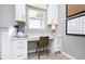 Cozy home office nook featuring built-in cabinetry, a granite desktop, and natural lighting at 7156 Firestone Rd, Whitestown, IN 46052