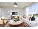 Comfortable living room features modern decor, neutral color palette, and a large window with abundant natural light at 7156 Firestone Rd, Whitestown, IN 46052