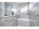 Walk-in shower featuring gray wood-look tiling, a built-in bench and a glass partition at 7156 Firestone Rd, Whitestown, IN 46052
