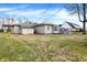 The exterior features stone and siding, a large backyard, and a screened-in porch at 725 Queenswood Dr, Indianapolis, IN 46217